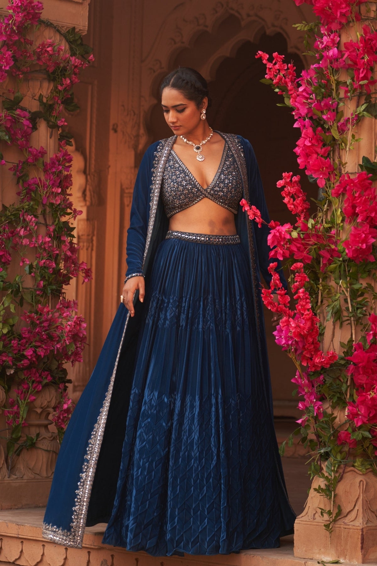 Teal Blue pleated lehenga set with makhmal cape