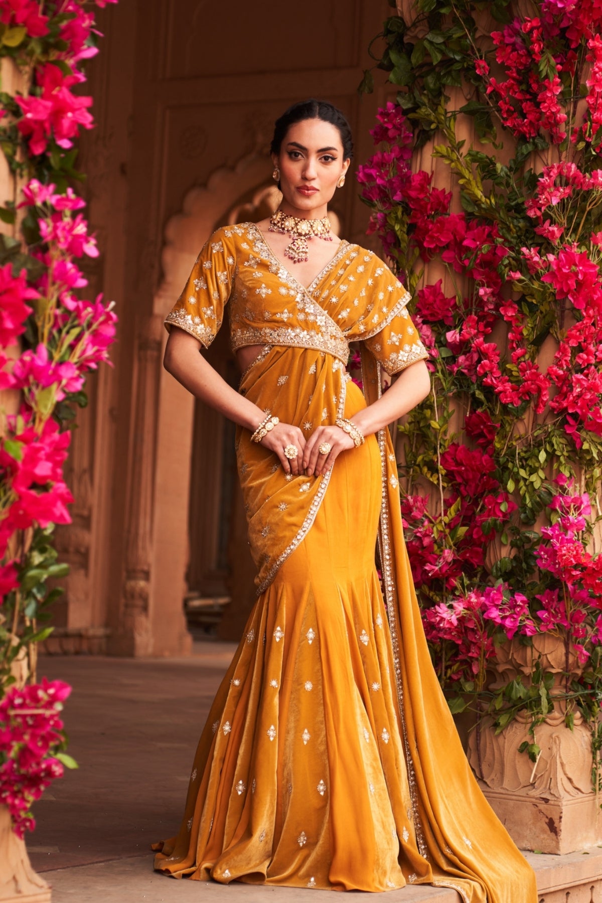 Yellow godet velvet saree with asymmetric blouse