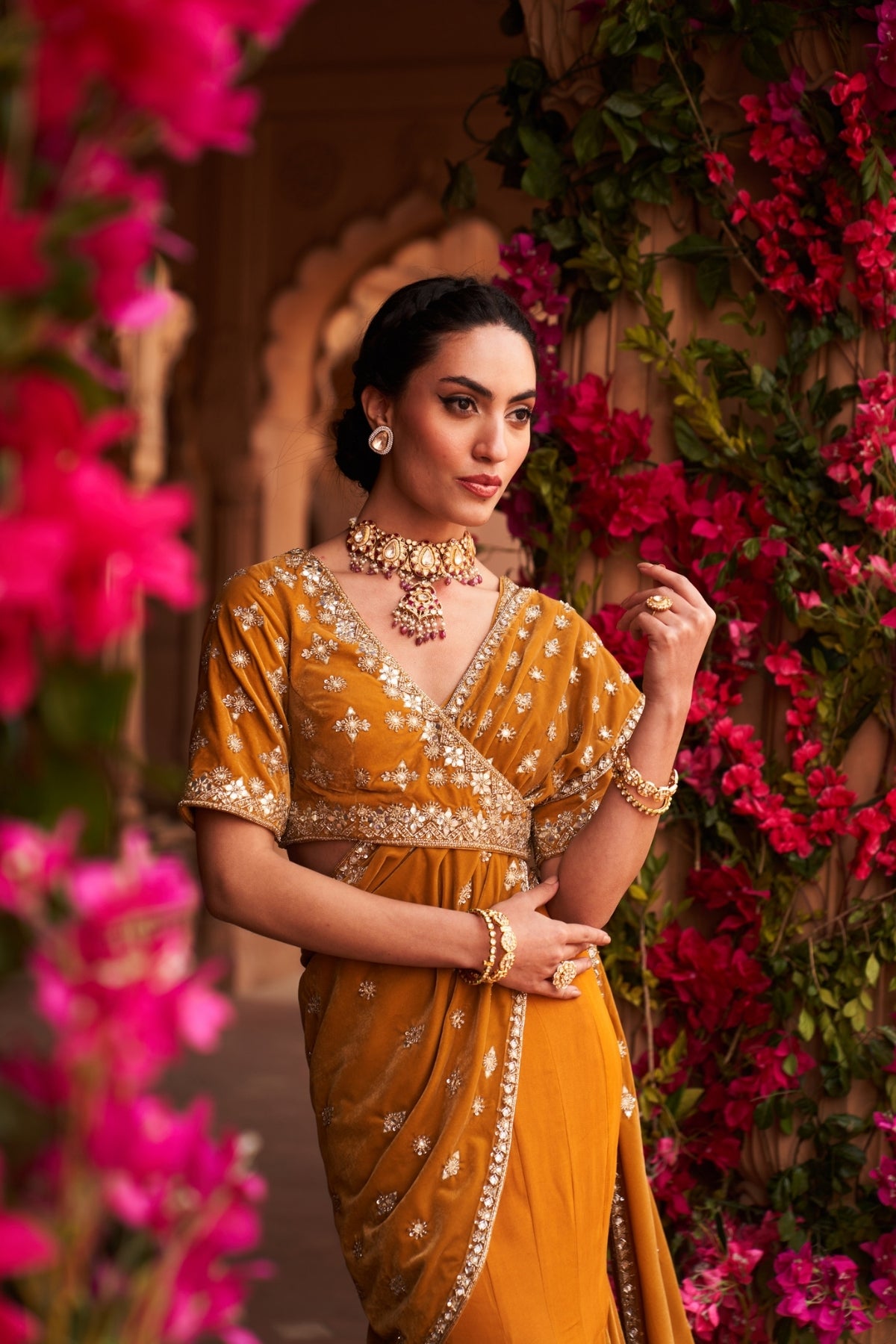 Yellow godet velvet saree with asymmetric blouse